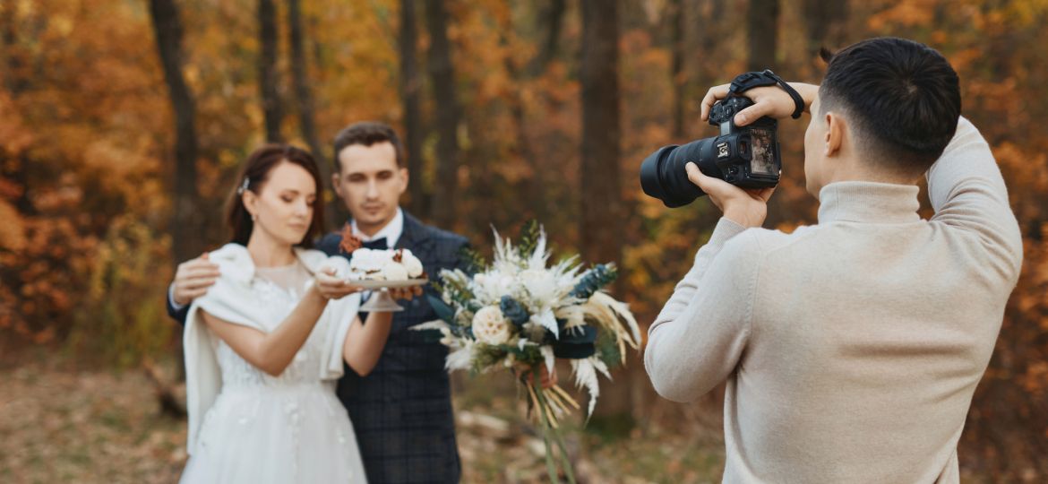 wedding photographer taking pictures of the bride and groom